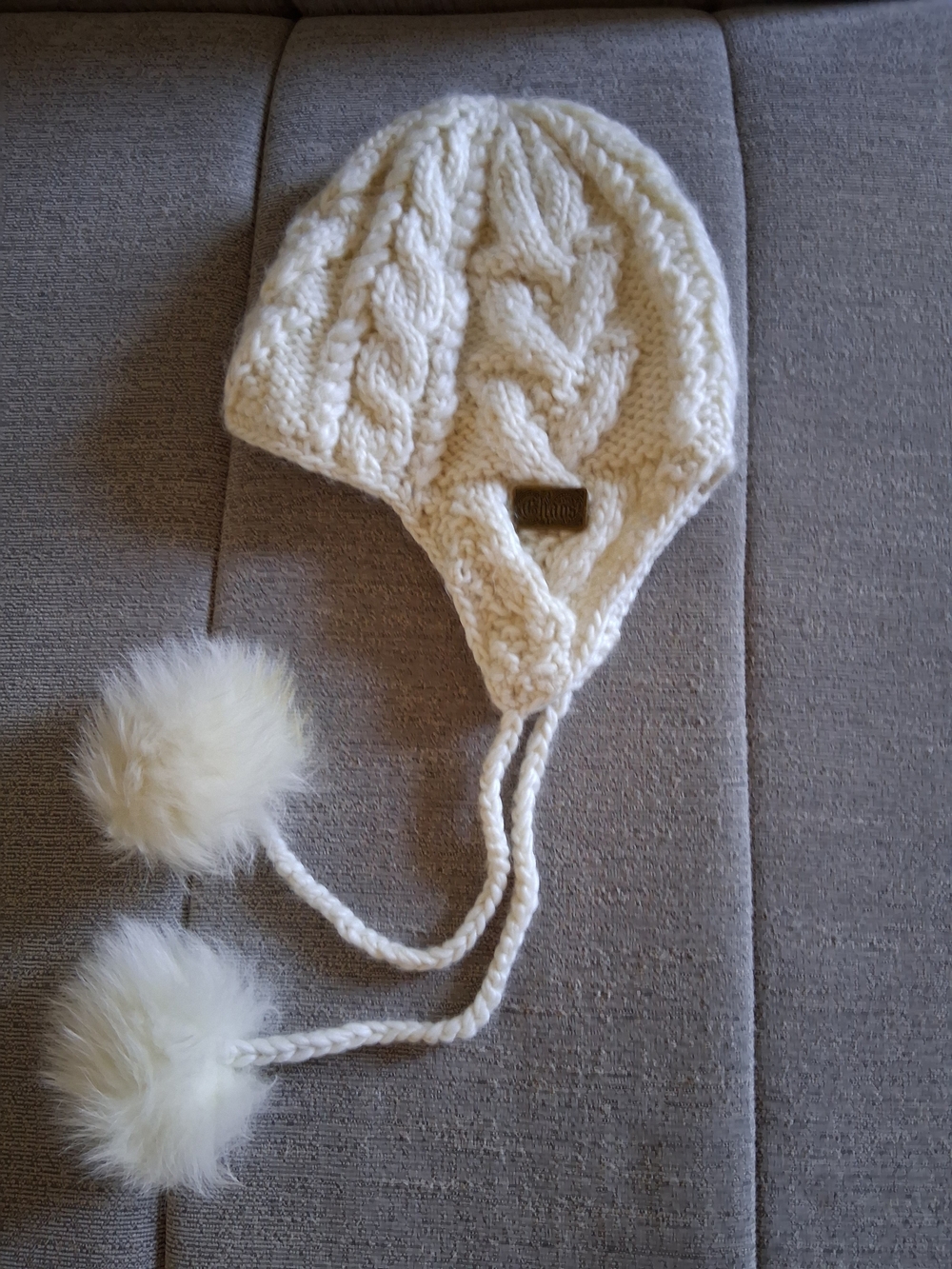 Cable Knit Wool Knitted Earflap Hat with Faux Fur Poms Cream
